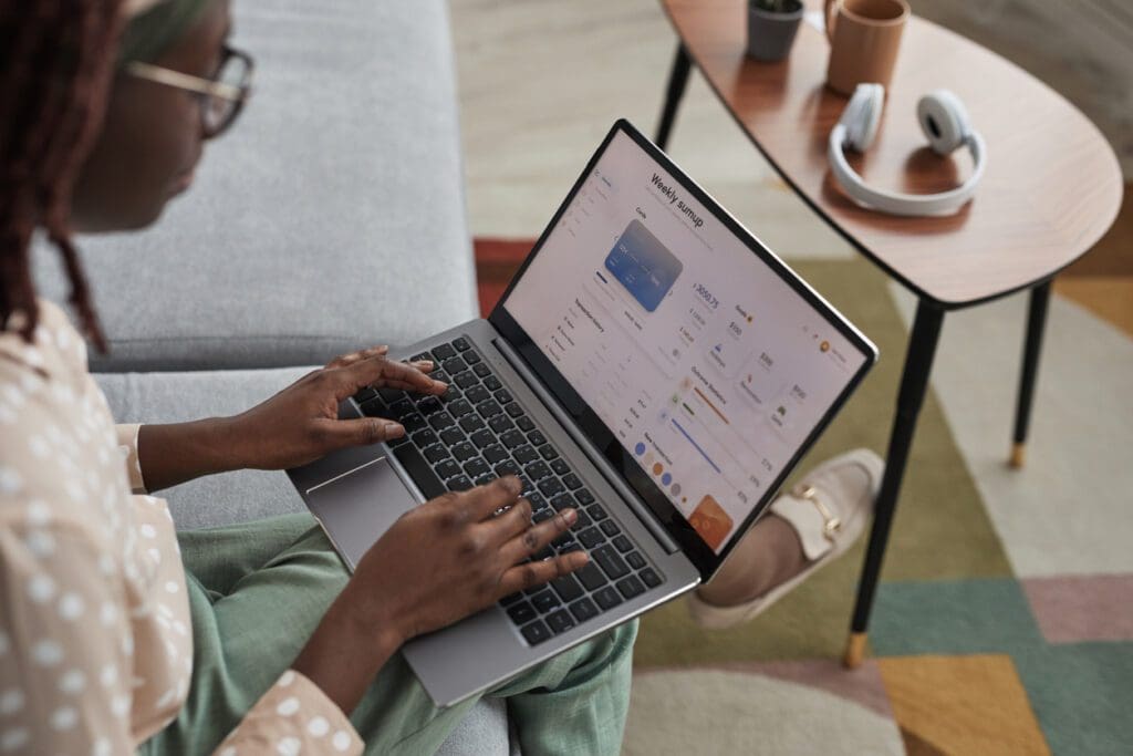 A young woman accesses a financial institution online to get answers to her complex customer questions.
