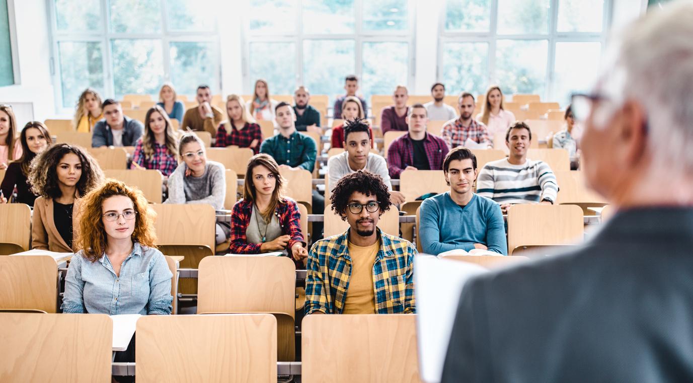A college classroom is filled with students recruited through an effective student enrollment strategy.