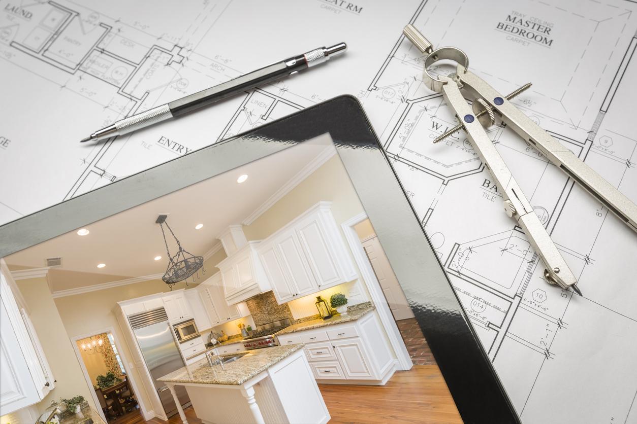 A tablet shows a mocked up kitchen based on blueprints, illustrating the selling potential of homebuilder technology.