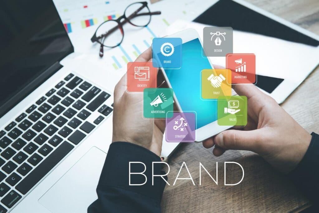A phone with branding icons hovering shows the importance of an internet presence in homebuilder branding.