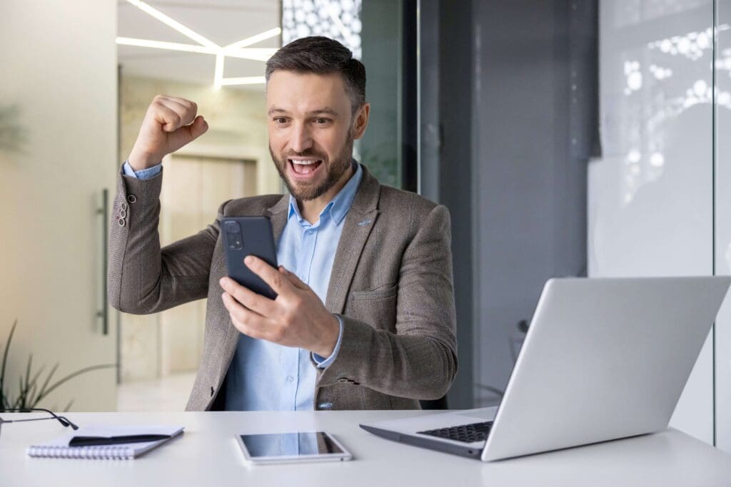 Mature, happy salesman nailing sales follow-up