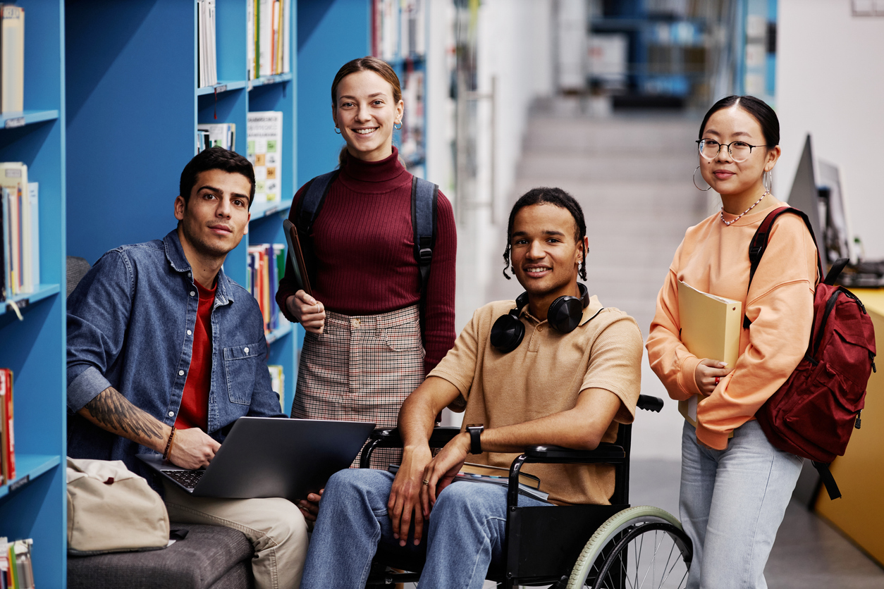 A diverse group of college students in a library.