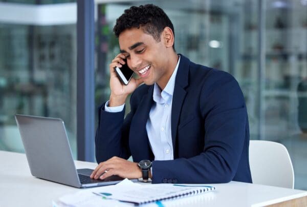 Happy salesman on the phone