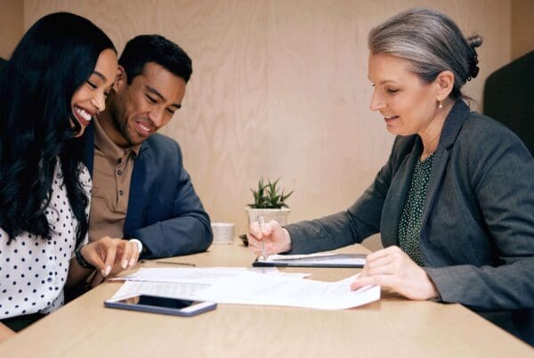 Couple looking at mortgage agreement