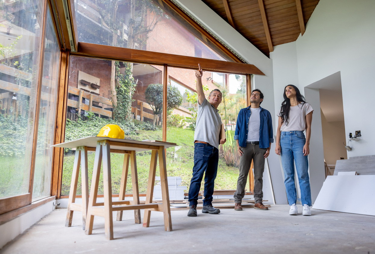 A contractor meets with a couple to discuss home improvement
