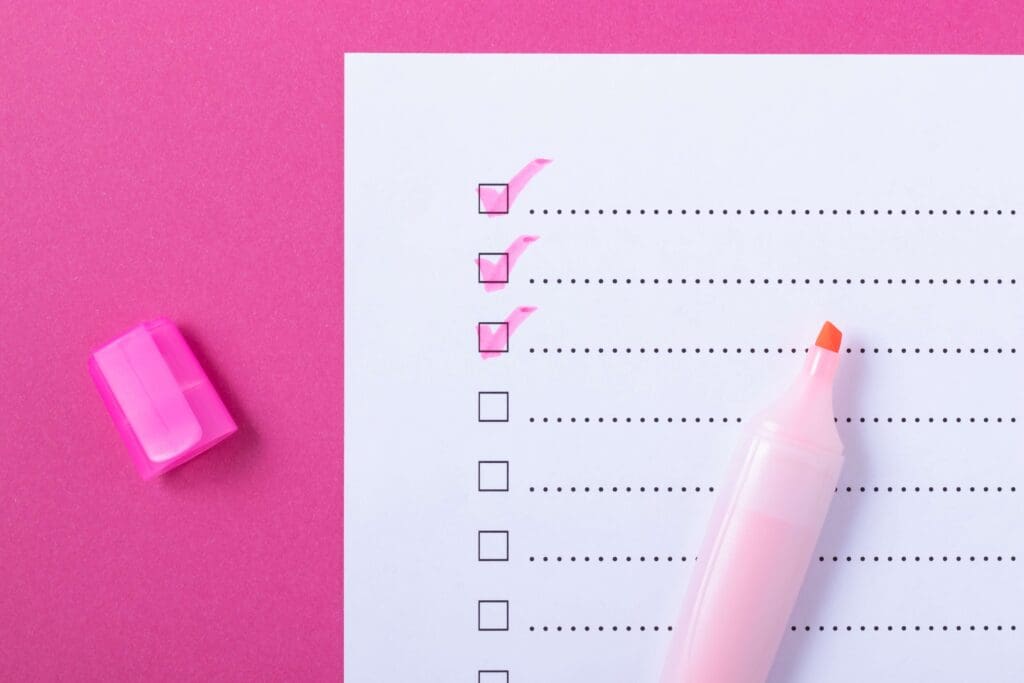 Checklist and pink highlighter