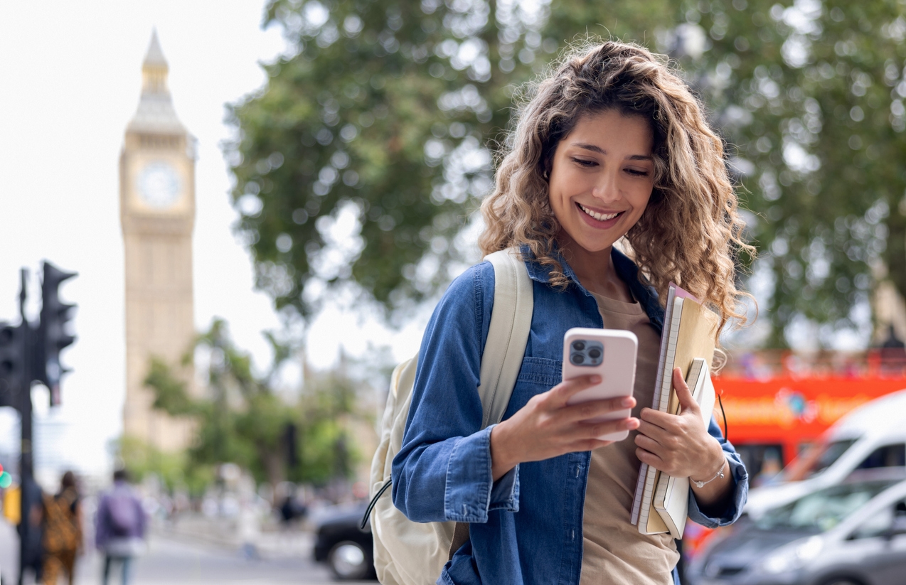 Graduate student receives recruitment message on phone via digital assistant.