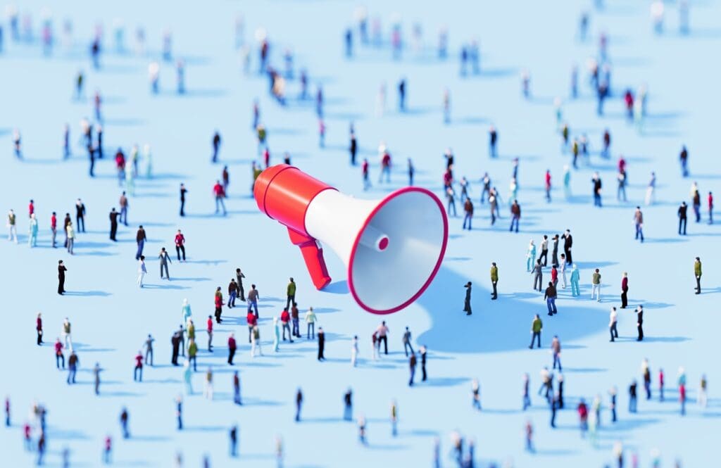 A megaphone in a crowd shows the importance of university branding.