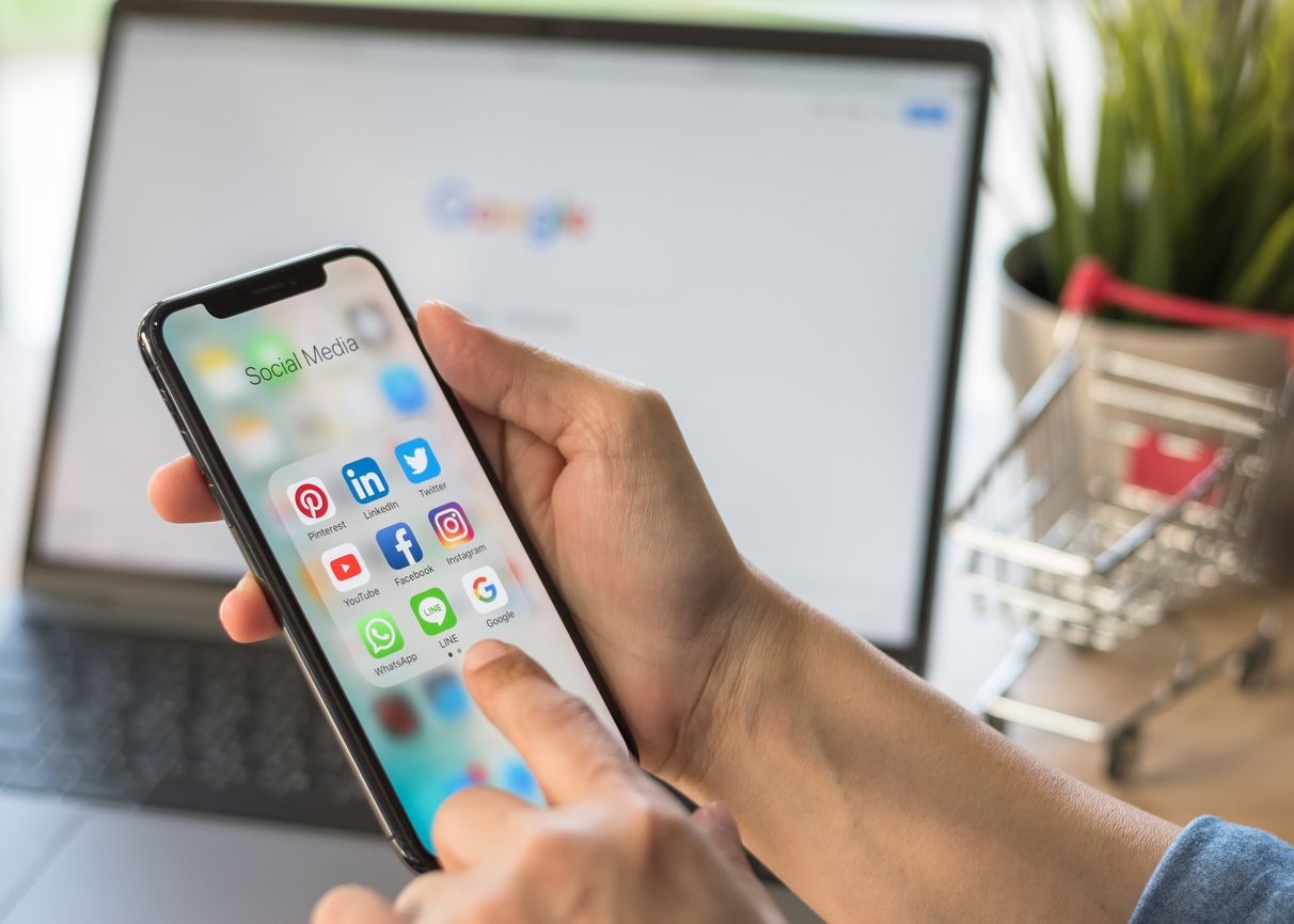 Social media apps on a phone show potential channels for university branding.