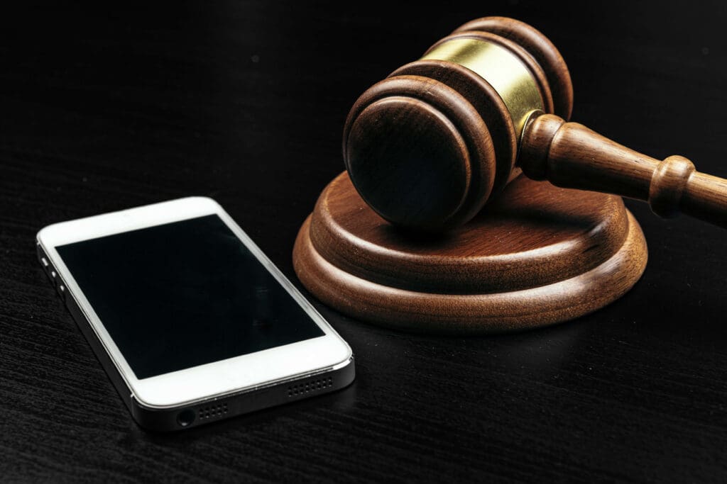 Smartphone and gavel, representative of the FCC ruling on internet leads