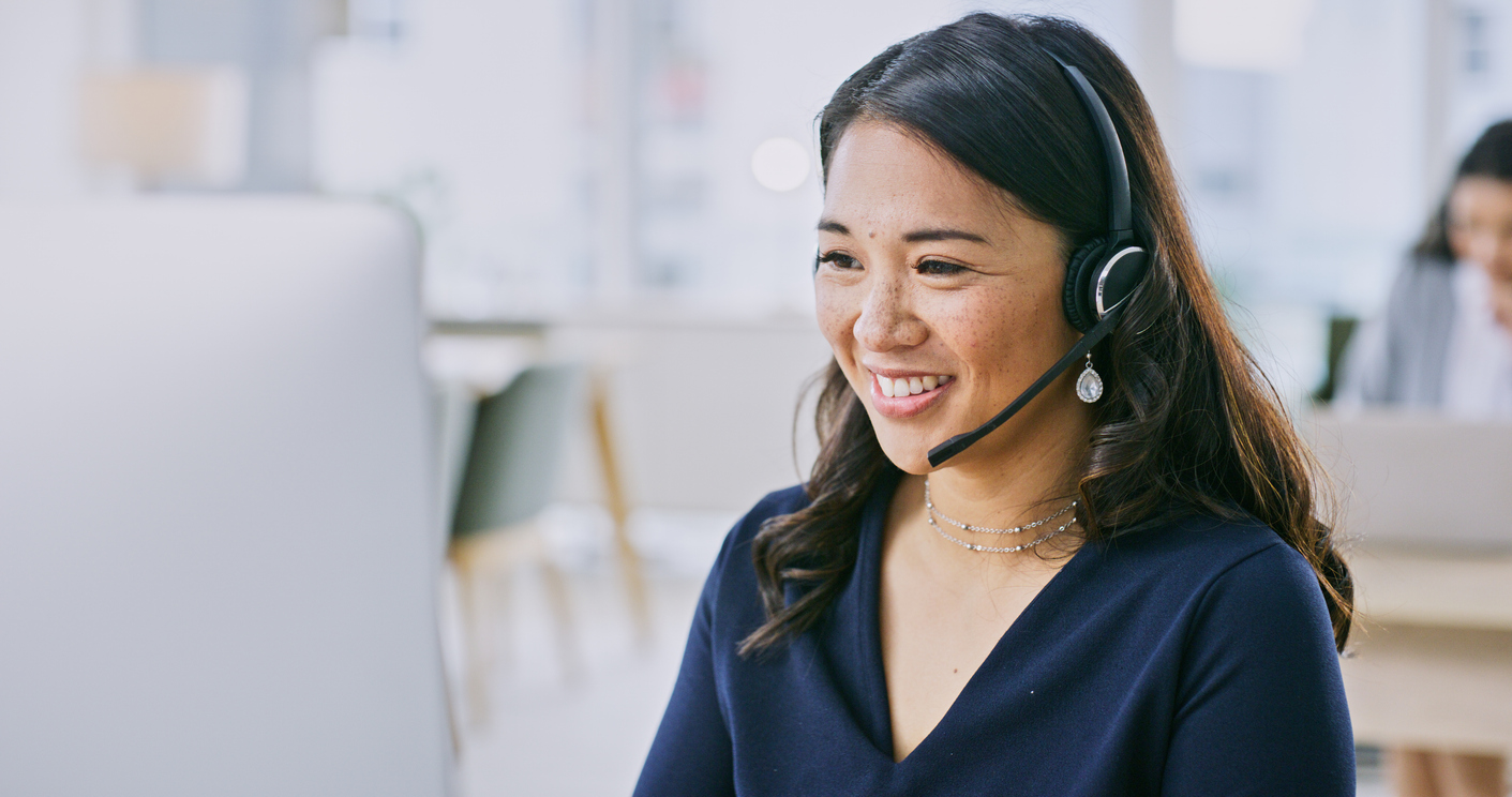 Female customer service rep takes call when AI chatbots are not able to answer a customer's question.