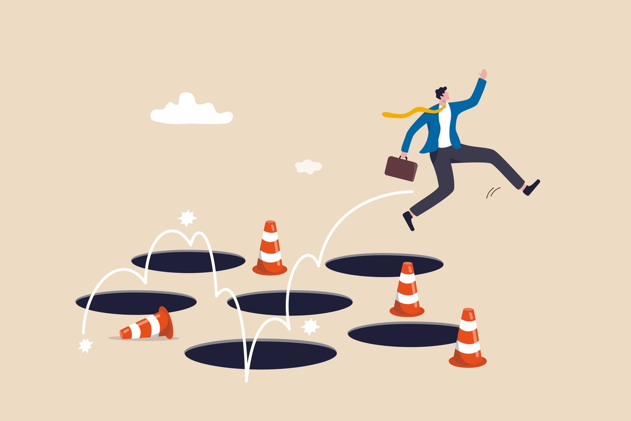 Illustration of a man jumping over holes shows the importance of avoiding pitfalls when choosing a conversational AI platform.