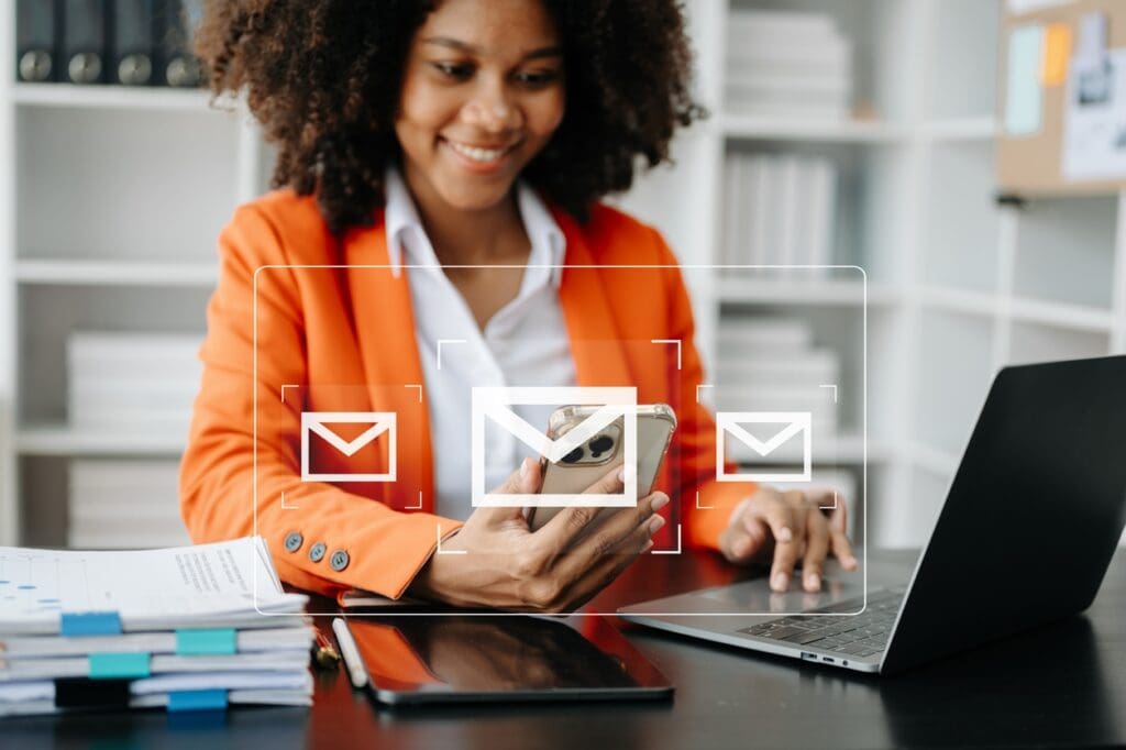 A woman gets an AI-generated email on her laptop as part of a lead engagement strategy.