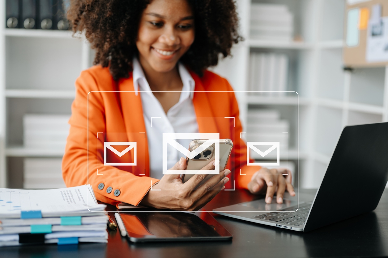 A woman gets an AI-generated email on her laptop as part of a lead engagement strategy.