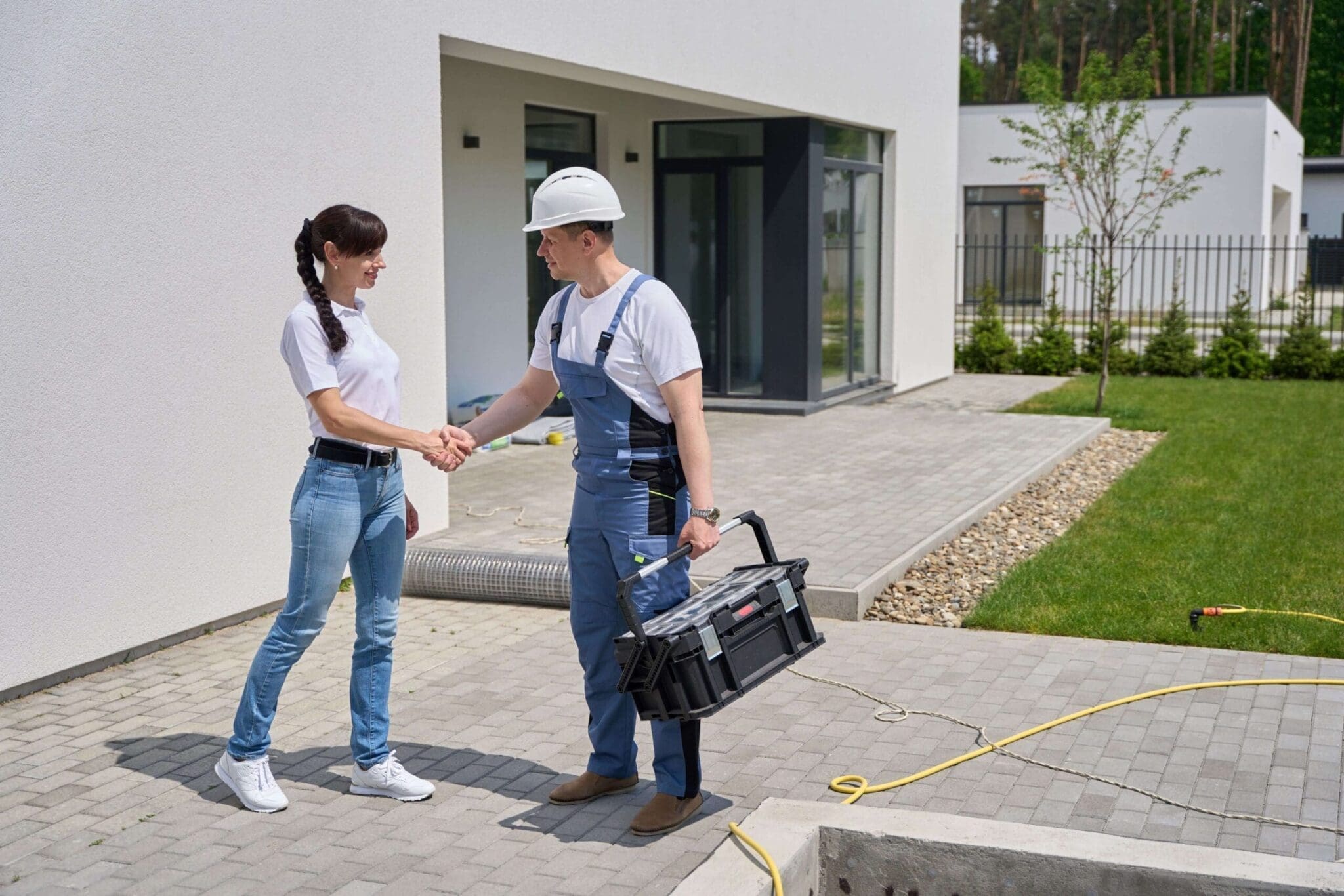 Home services technician shaking hands with a customer