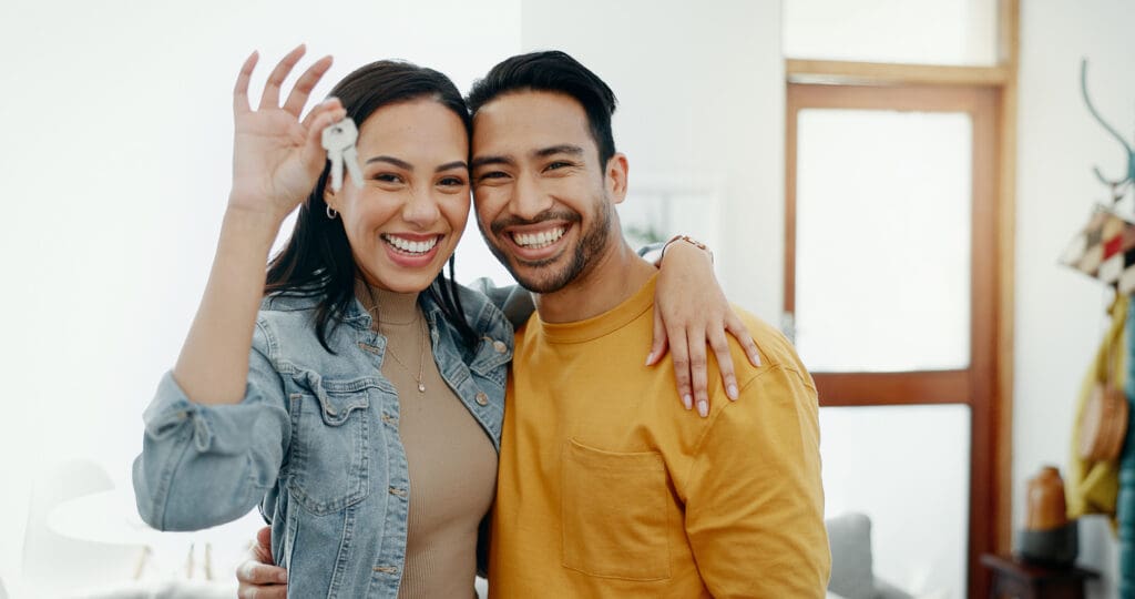 Happy couple buys home they found through good homebuilding branding.