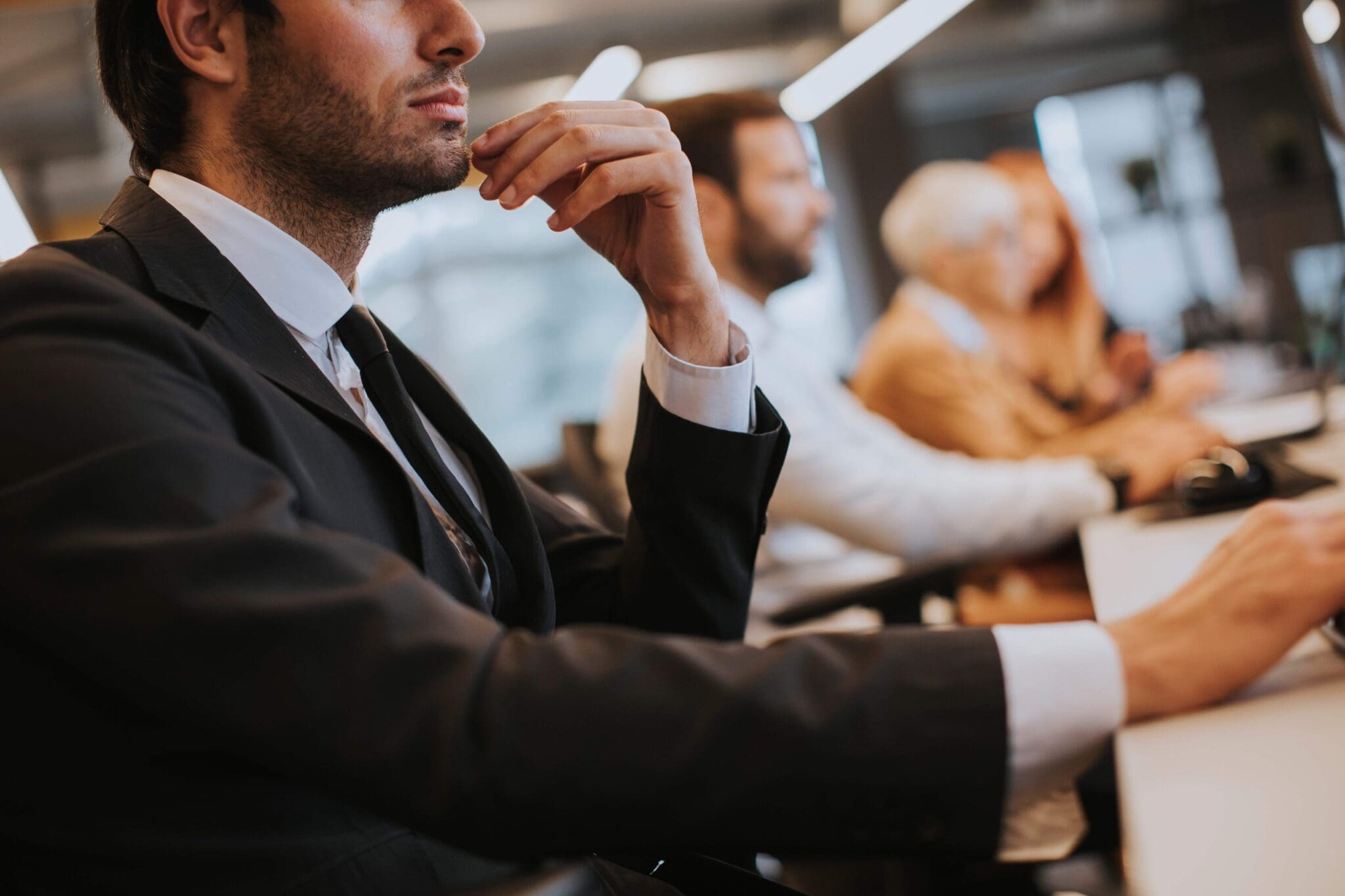 Salesperson contemplating during a meeting