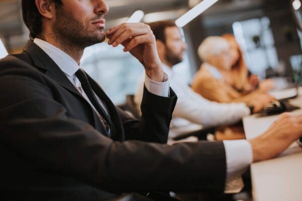 Salesperson contemplating during a meeting