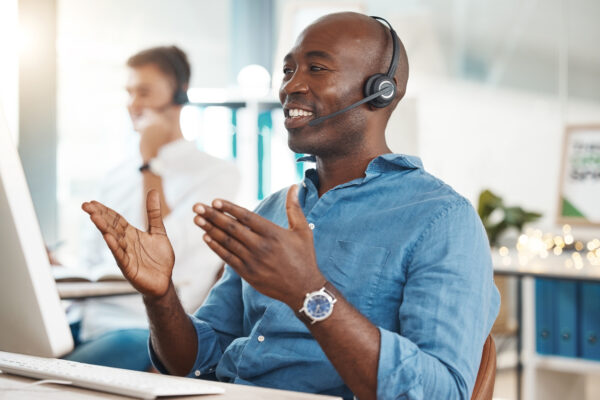 SDR on his headset answering customer questions illustrates the importance of the SDR role and how it will work with AI going forward.