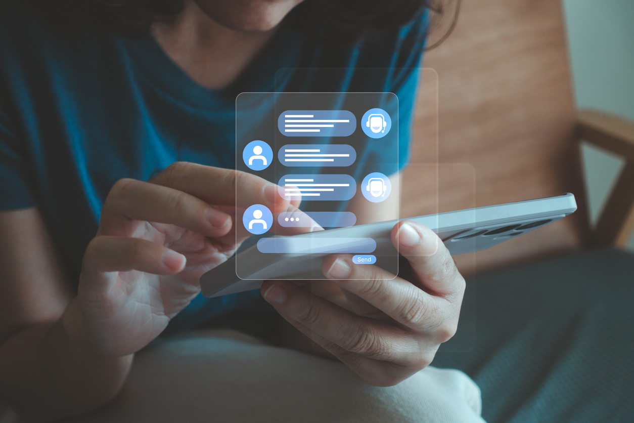 Customer accesses an AI chatbot on her phone, illustrating how AI will work with SDRs to meet customer needs. 