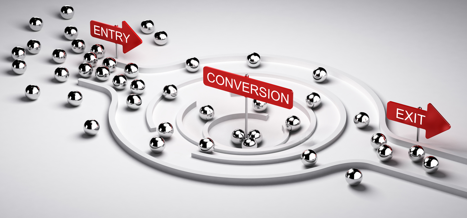 Illustration of a sales conversion funnel with leads represented as balls and many entering with only some getting caught in conversion. 
