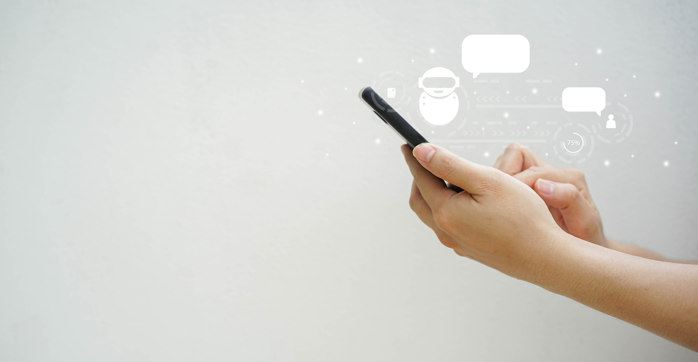 A prospect uses their phone to answer questions for an AI-powered chatbot as part of a lead qualification strategy. 