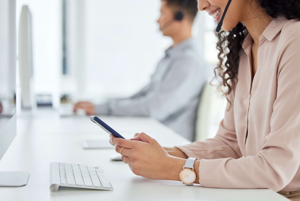 Call center agent texting customers
