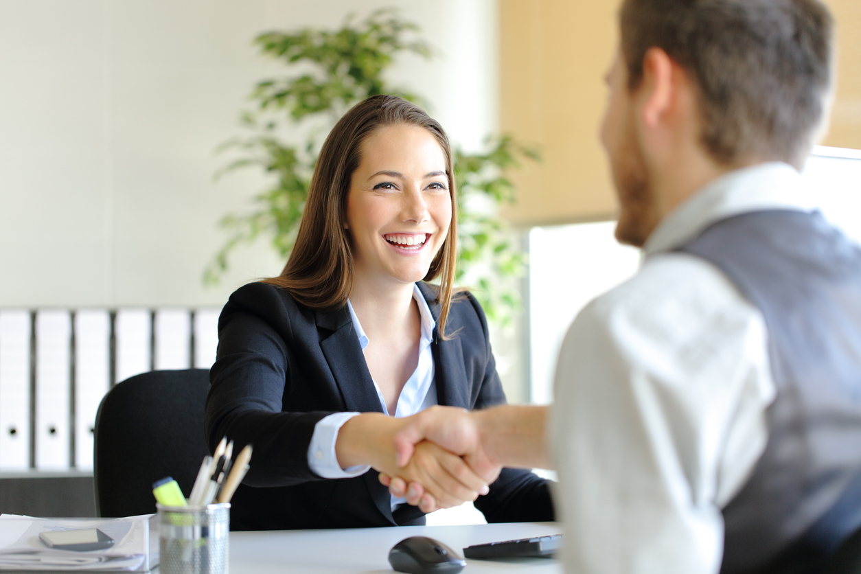 Handshake between salesperson and customer.