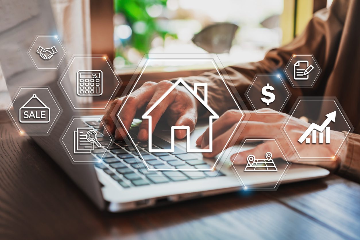 Real estate agent works on a laptop to compare data gathered by her AI-powered chatbot. 