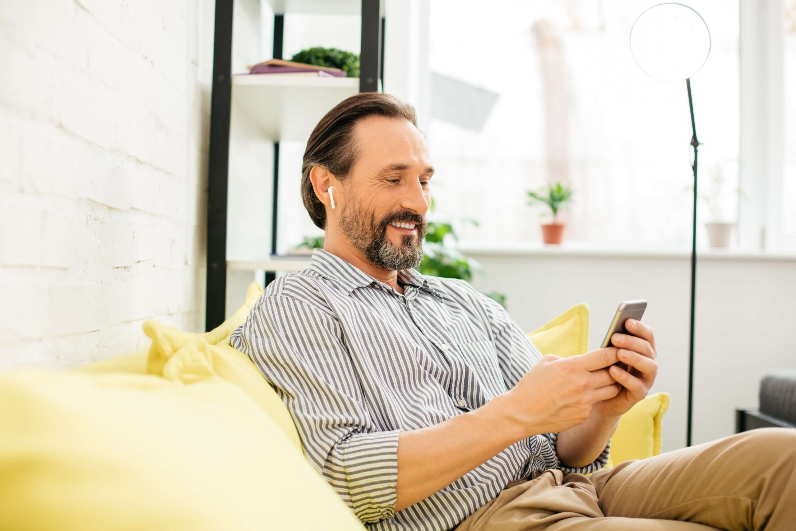 Man using conversational SMS at home