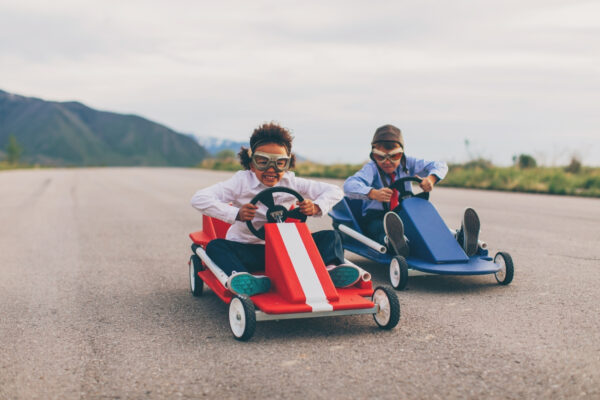 Two kids racing on go-carts illustrate the competitive advantage of being fast when it comes to following up on leads.