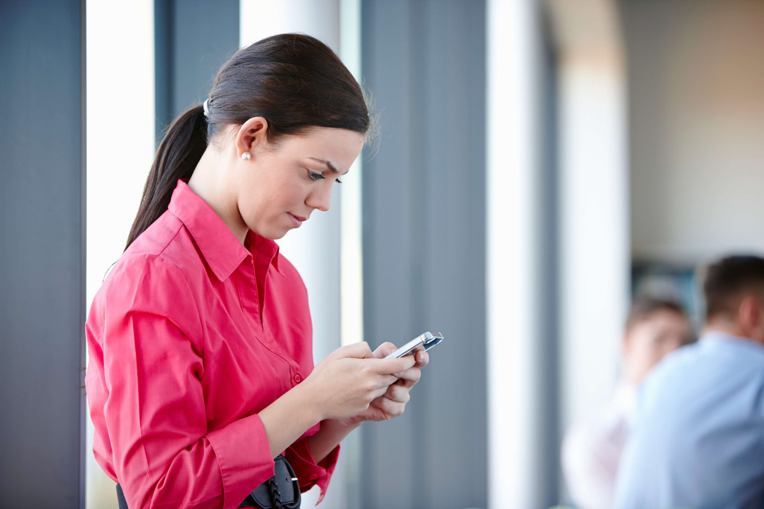 Businesswoman using two-way texting