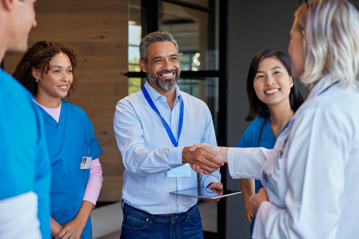 A group of homebuilders at a conference introduces themselves.