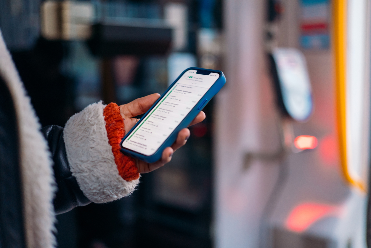 Person scrolls through many text notifications on their phone.