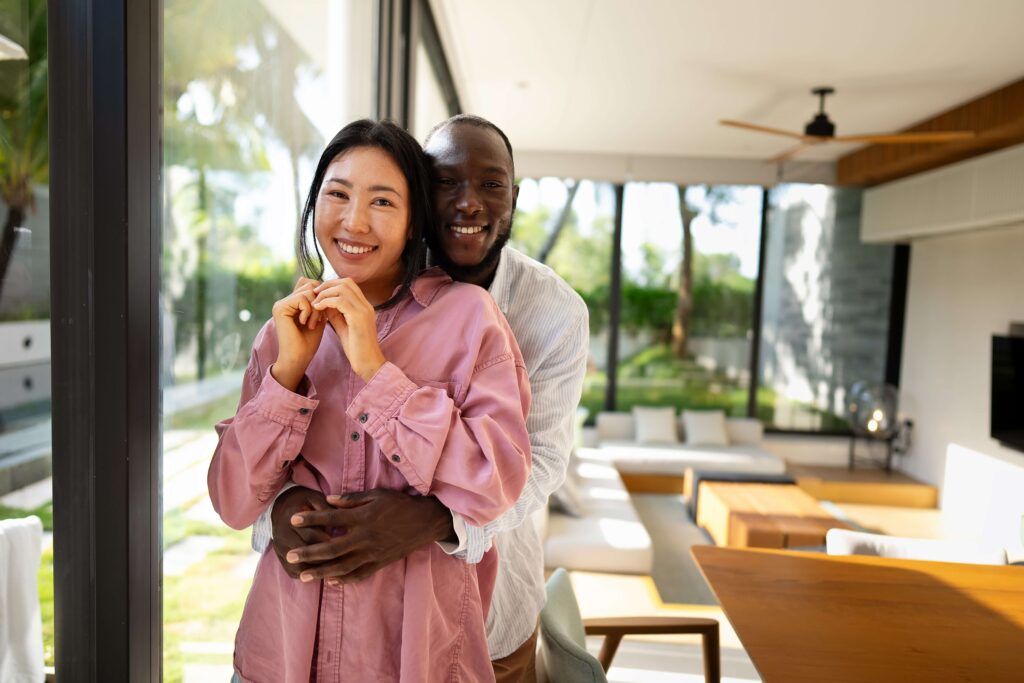 Happy couple after buying a home using AI texting