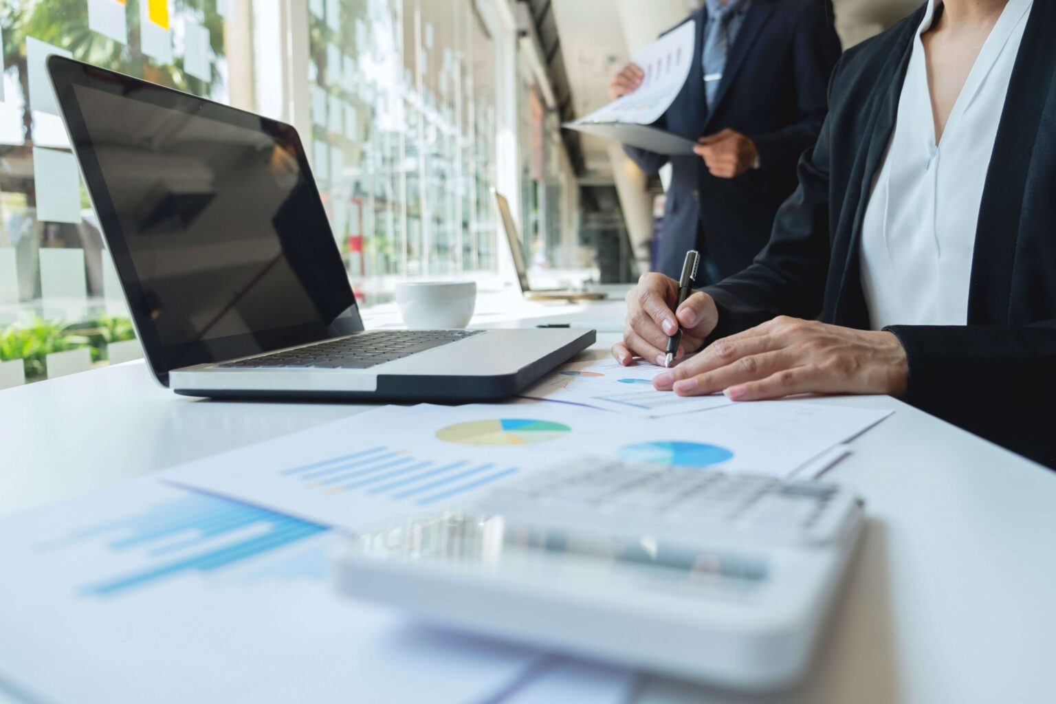 Marketing professionals calculate and discuss cost per lead.