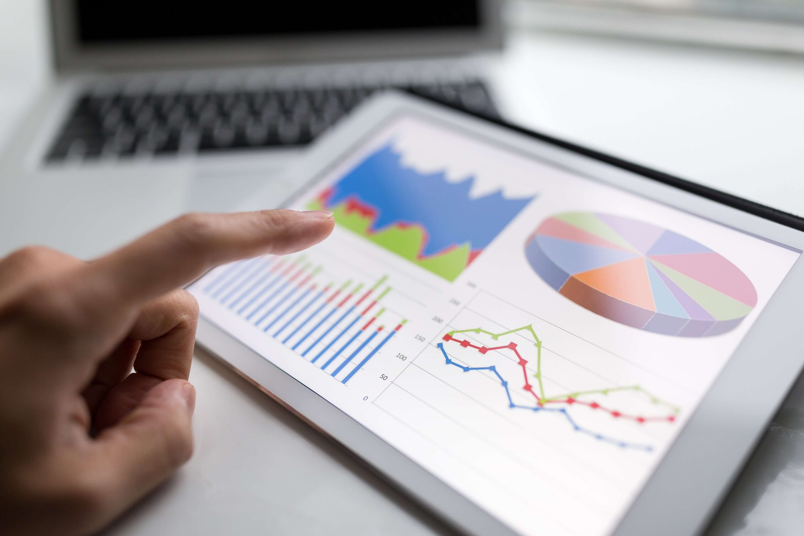 Marketer checks KPIs on a tablet