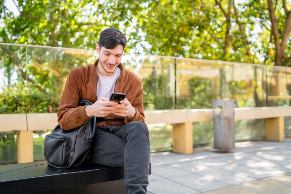 Young man texts about student debt
