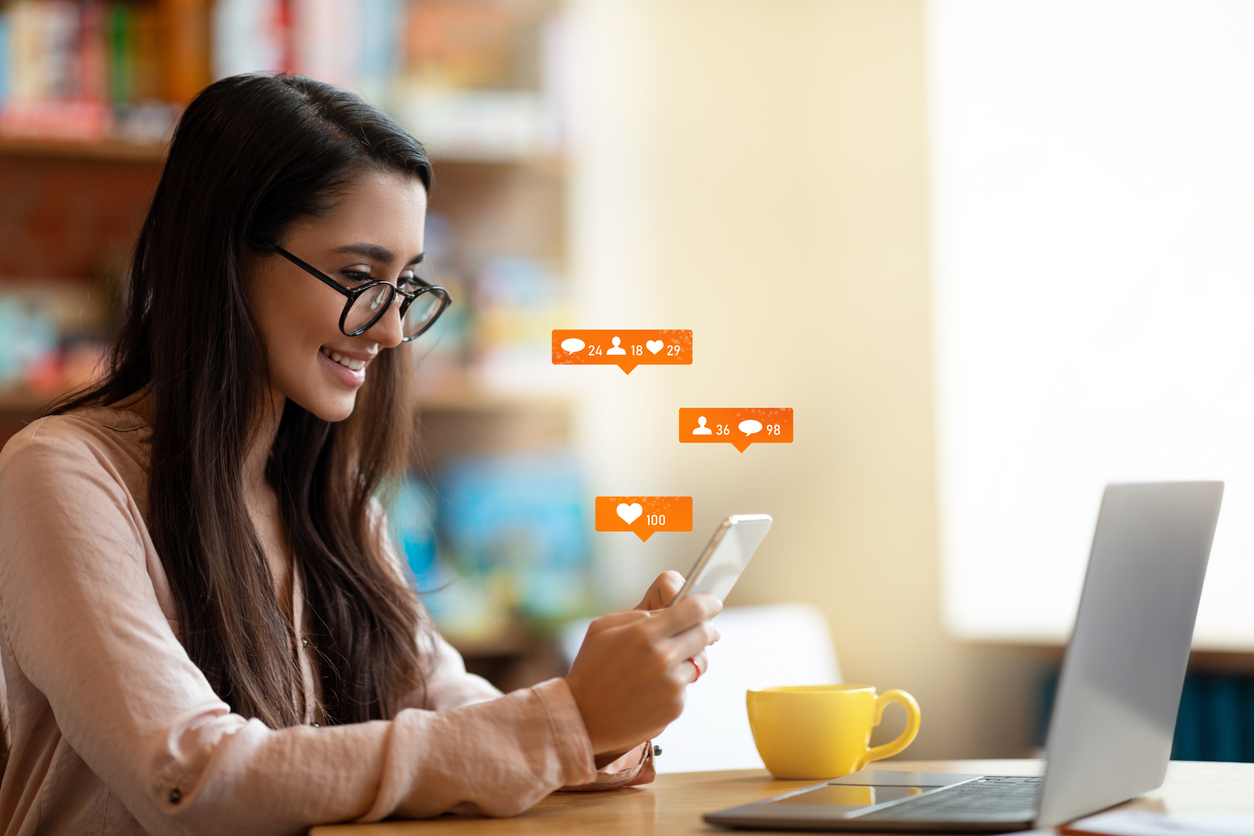 Woman uses her phone to engage with a brand through conversational SMS.