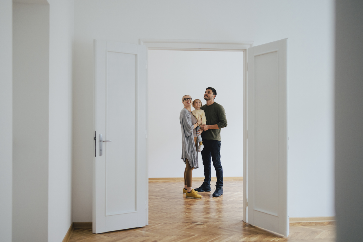 A family looks at a home to buy, illustrating how big the decision is and how important lead nurturing is for mortgage companies.