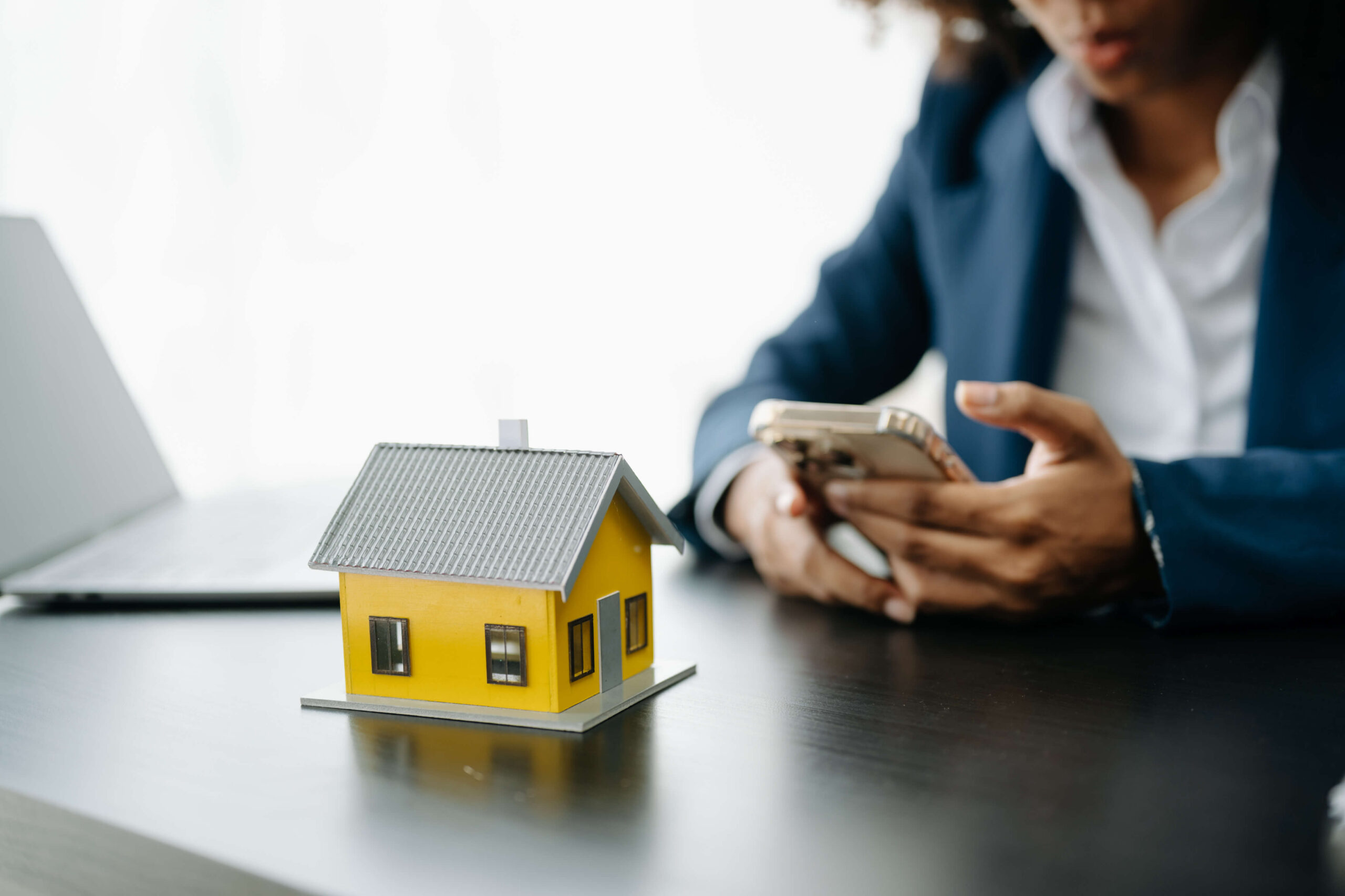 Loan officer uses smartphone to text a client