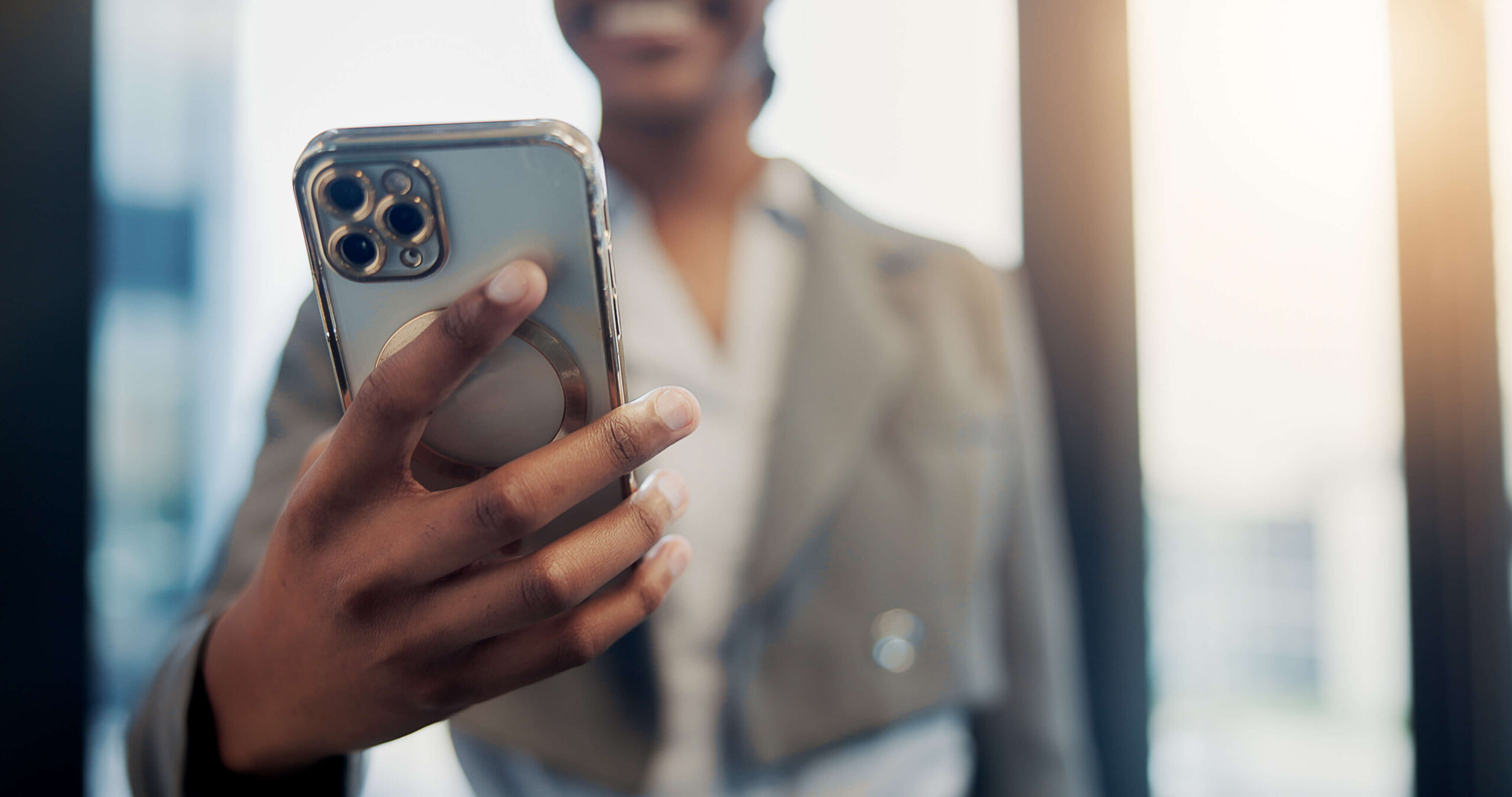 Business woman checks her cell phone