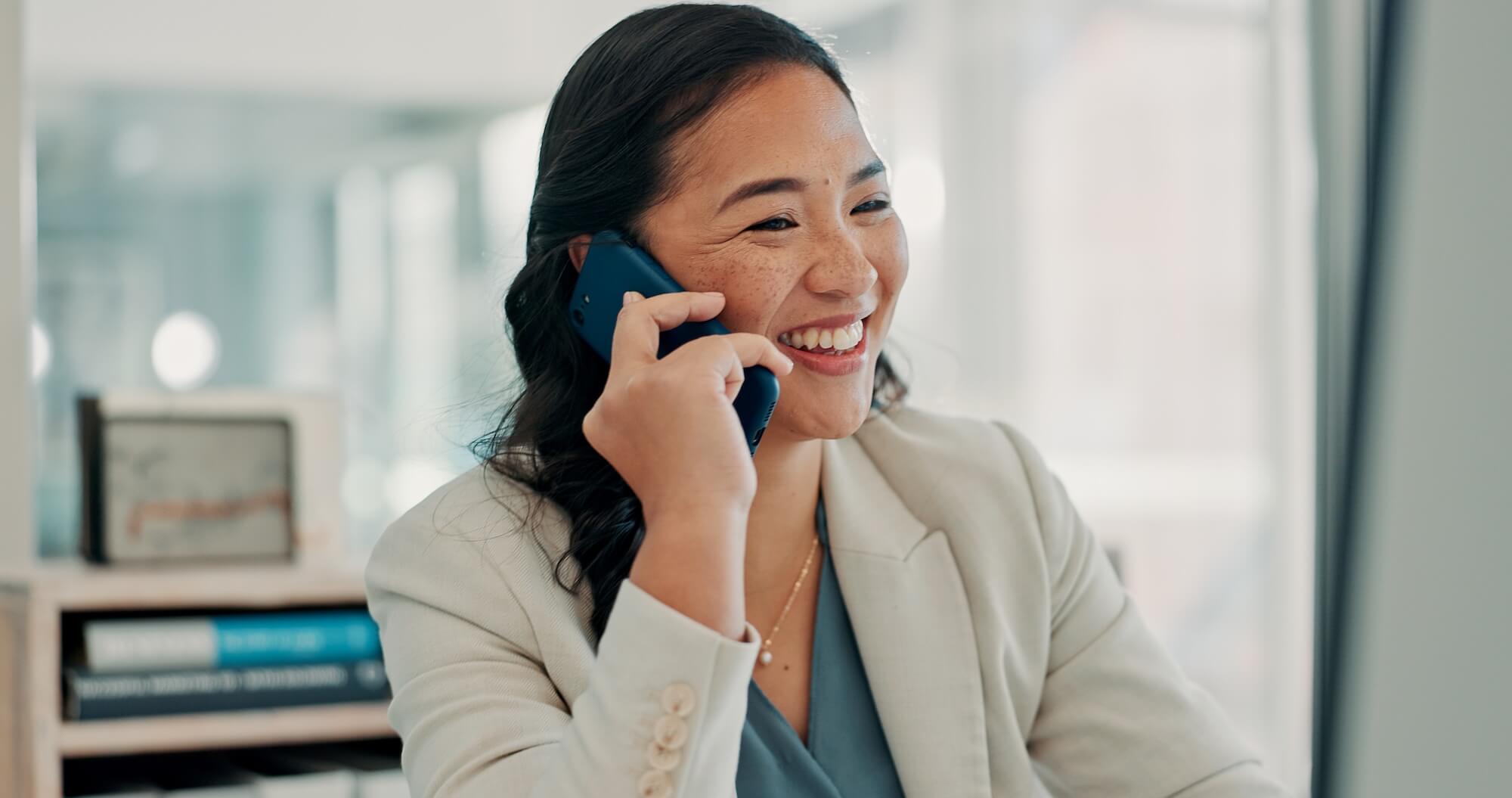 Sales rep speaks on the phone, symbolizing how AI-powered voice agents do not replace human interaction