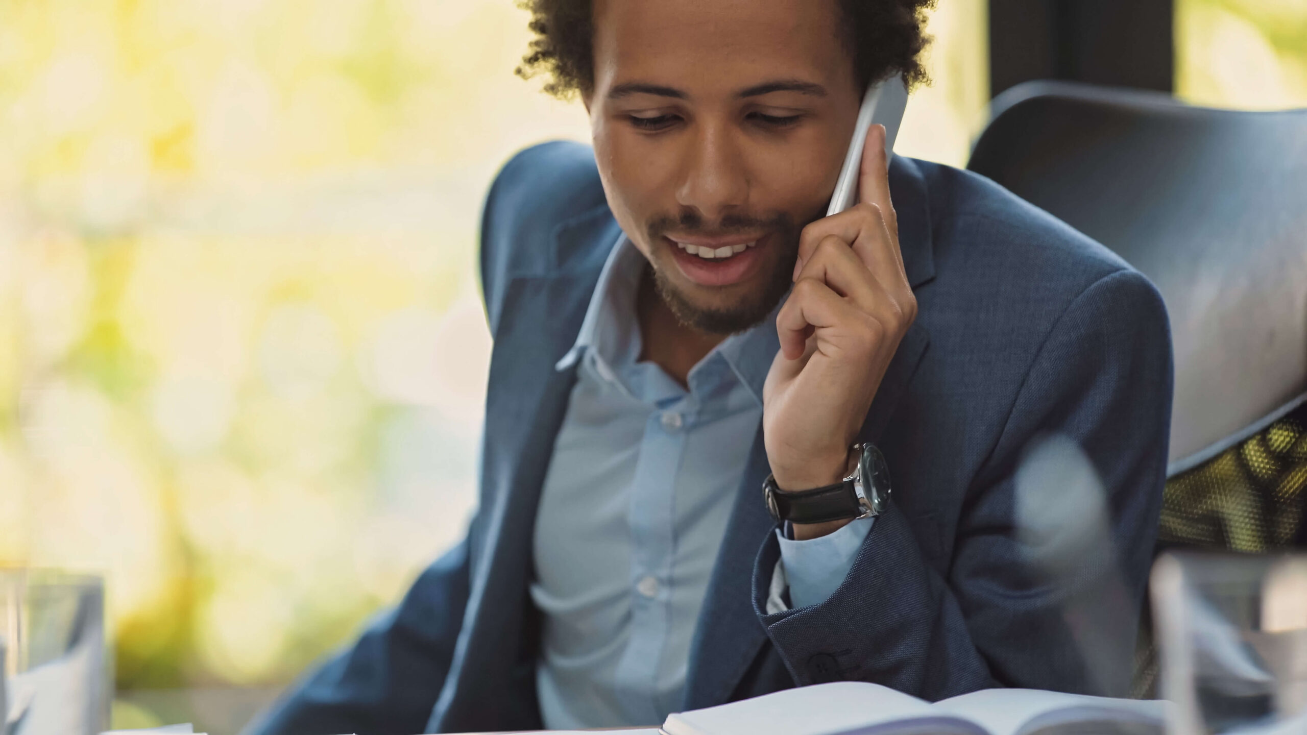Sales professional on phone, representing how AI voice agents for sales give human teams time back