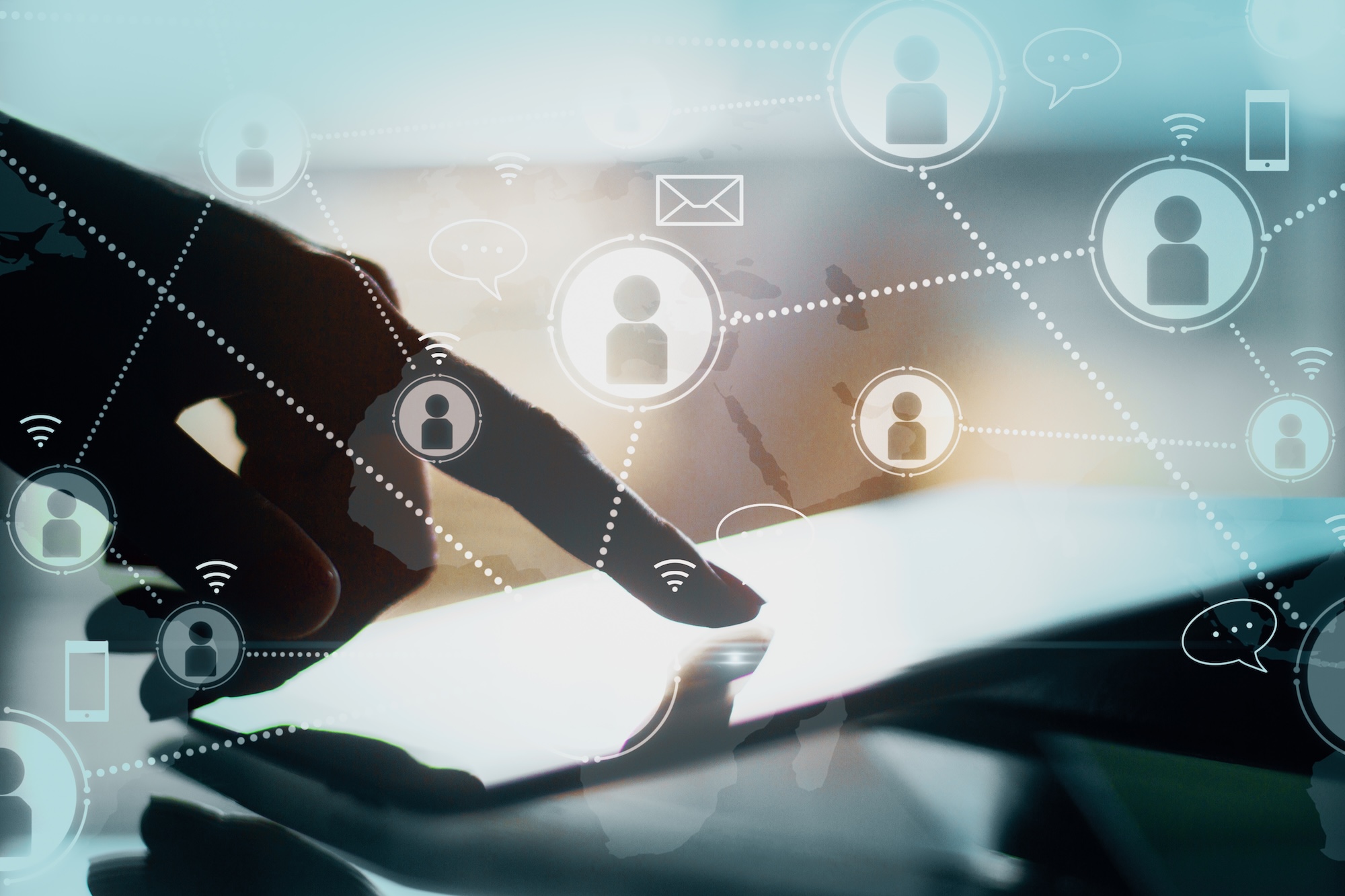 Hands using a tablet connecting user icons across channels, representing omnichannel communication