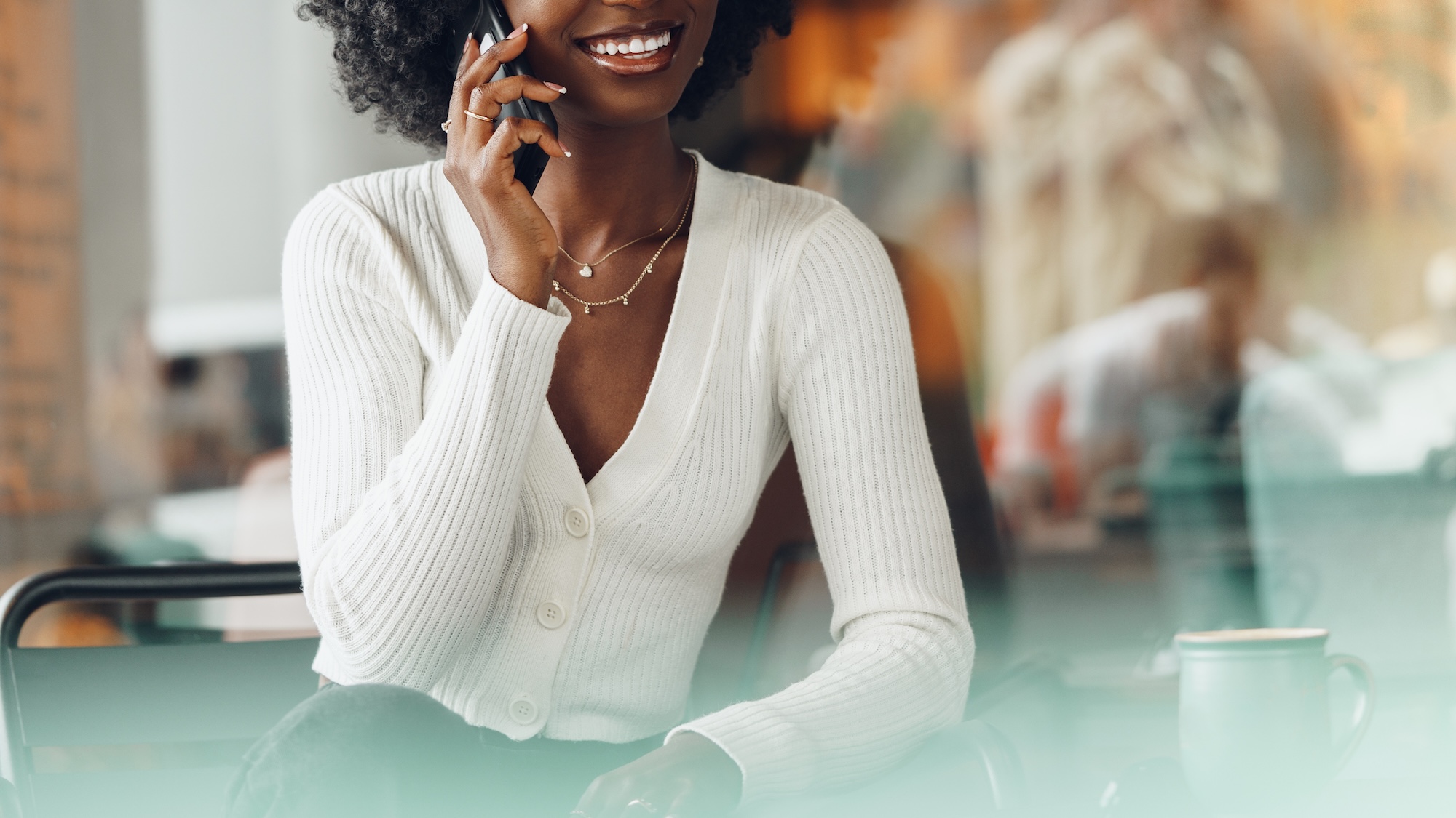 Woman speaks on the phone with an AI voice agent