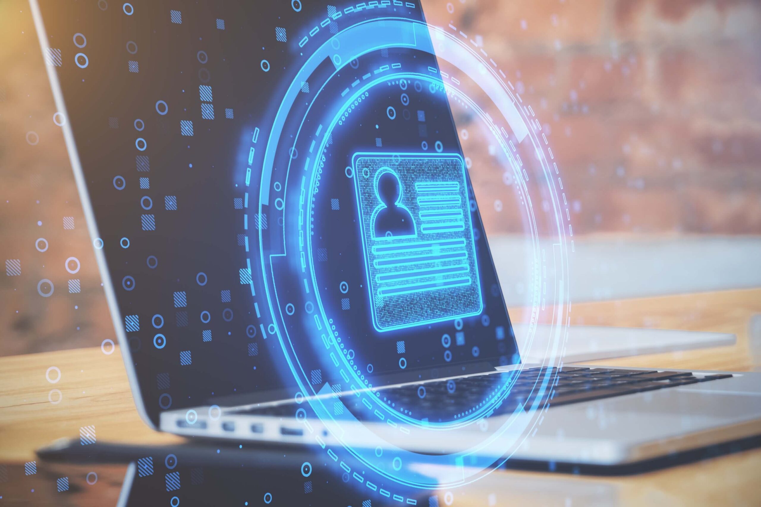 Abstract image showing an ID over a laptop, symbolizing data privacy