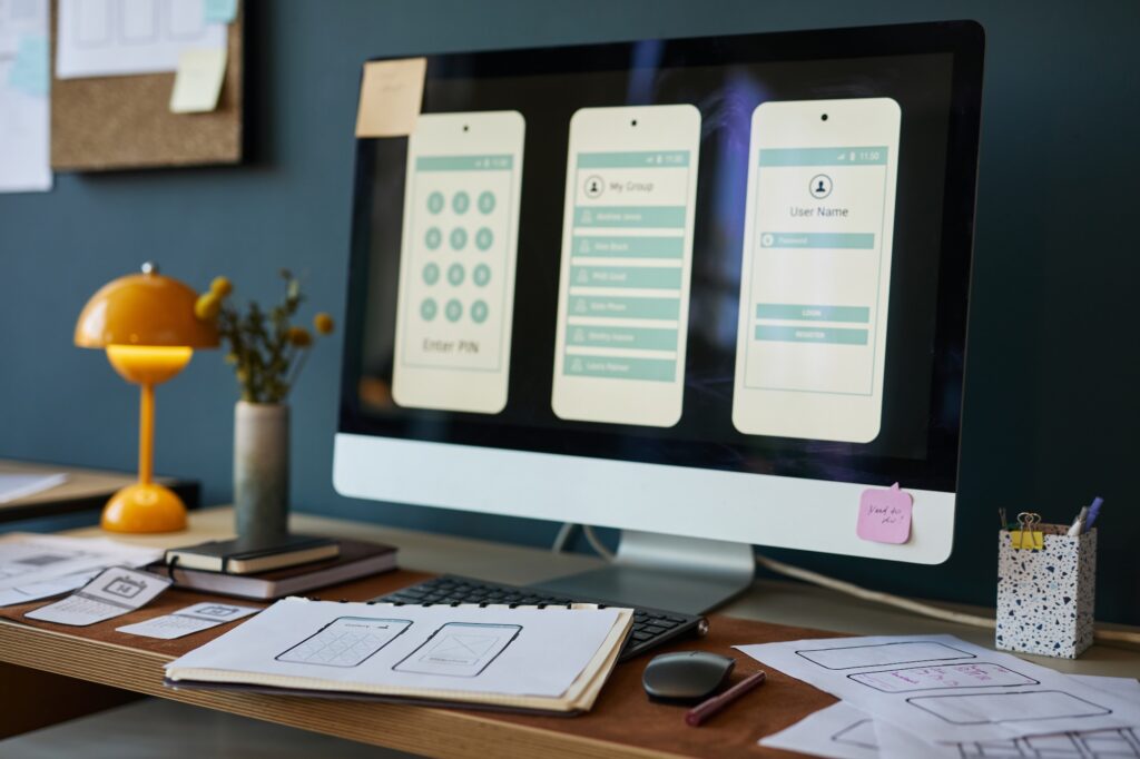 Computer monitor displaying app interfaces