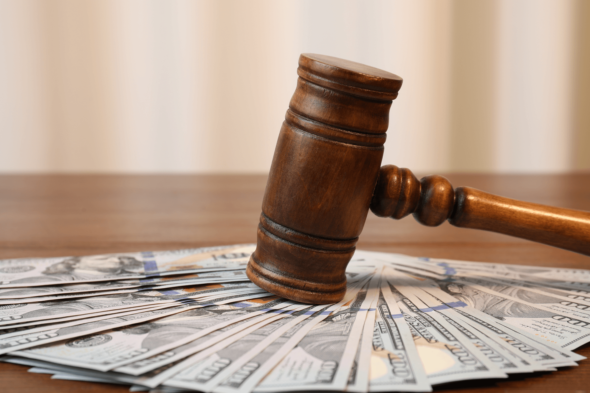 Gavel and cash, representing fines for TCPA violation